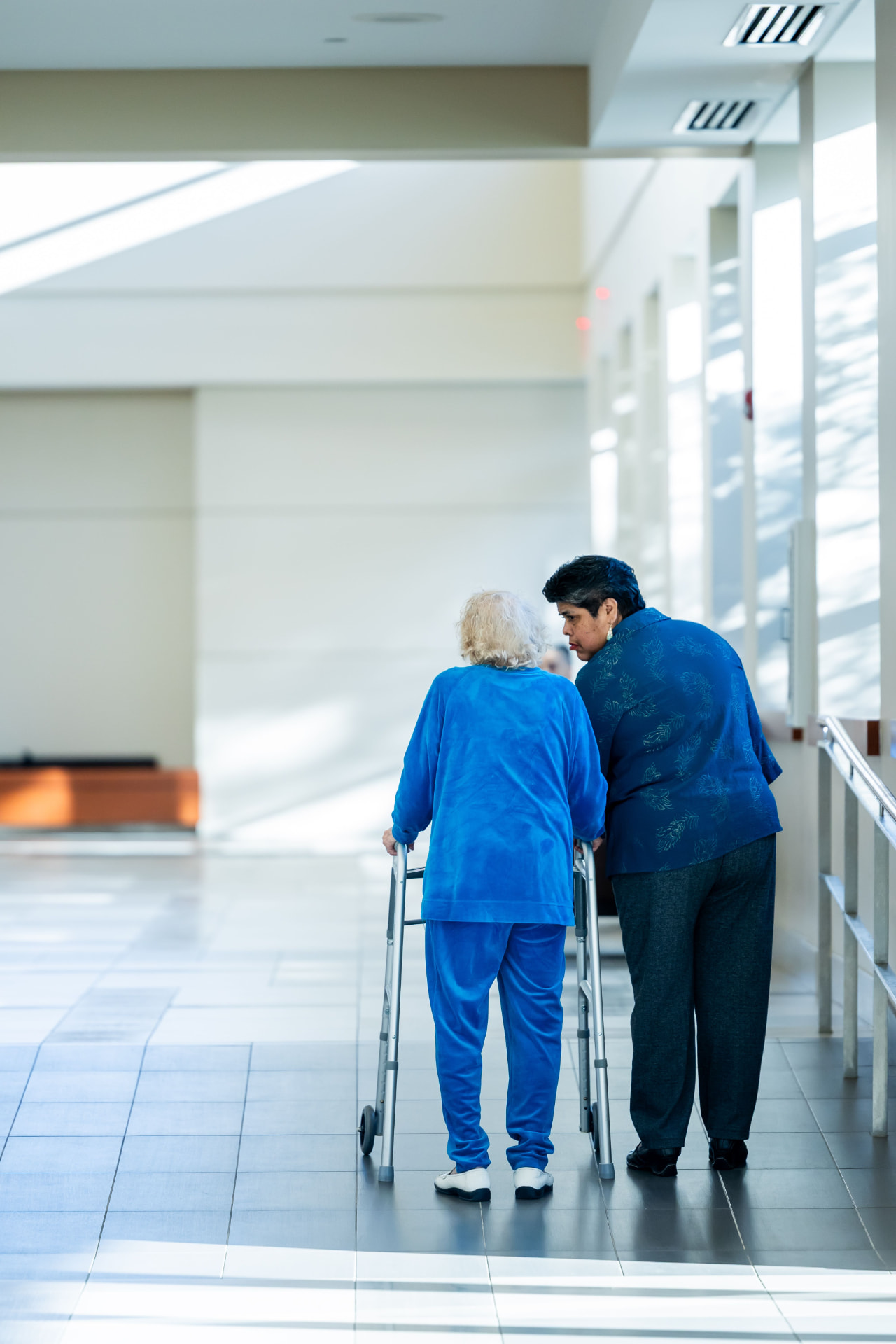 A senior with a caregiver (temporary photo)